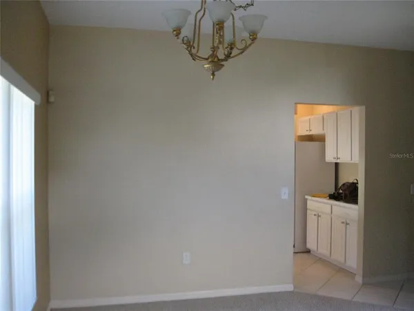 a view of a storage & utility room with a window