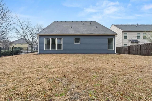 a backyard of a house with lots of green space