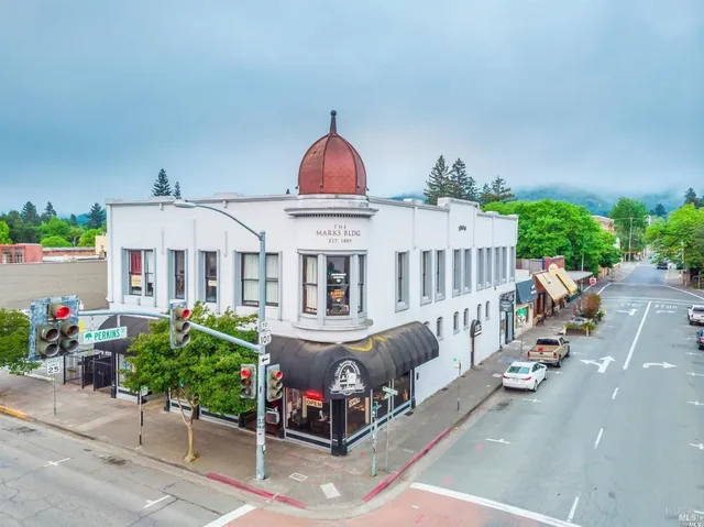 a view of a house with garden and sitting area