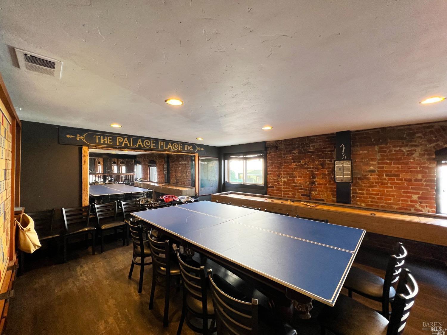102 South State Street Ukiah, CA 95482 - Photo 12 of 20 a room with furniture pool table and windows