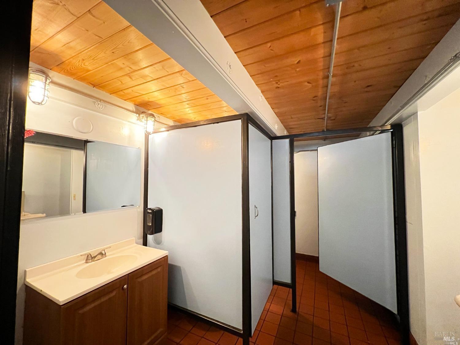 102 South State Street Ukiah, CA 95482 - Photo 15 of 20 a bathroom with a sink and a mirror
