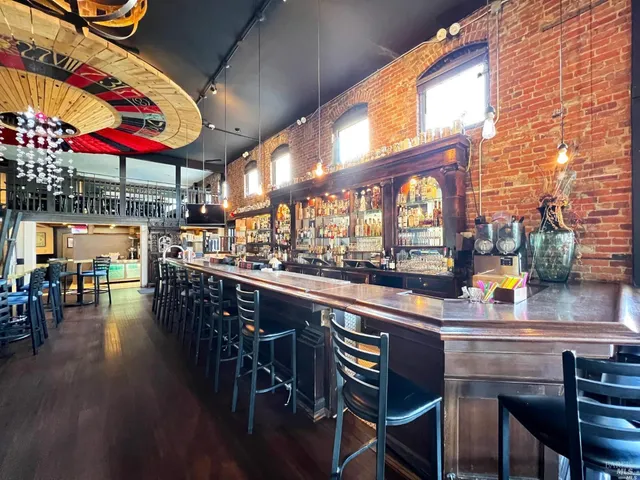 a group of people sitting outside of a building