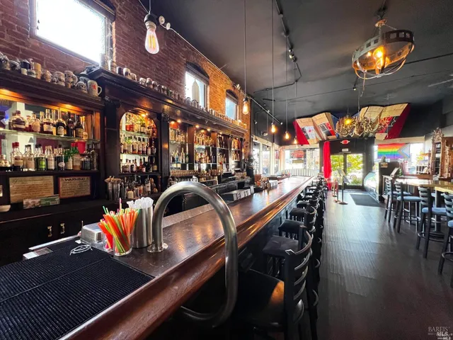 a view of swimming pool with a table and chairs