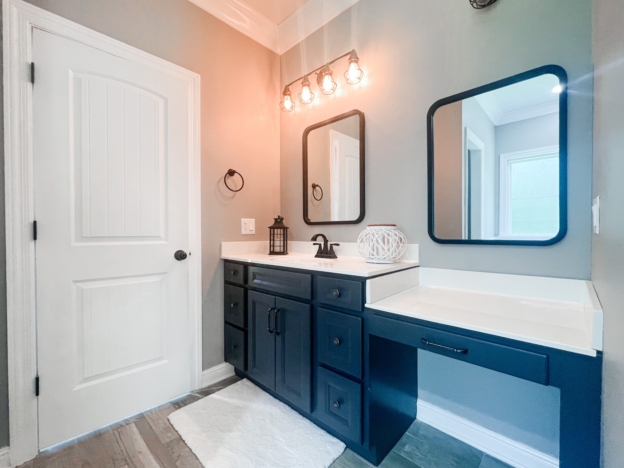 10848 Newtown Road Rockvale, TN 37153 - Photo 13 of 28 a bathroom with a double vanity sink and a mirror