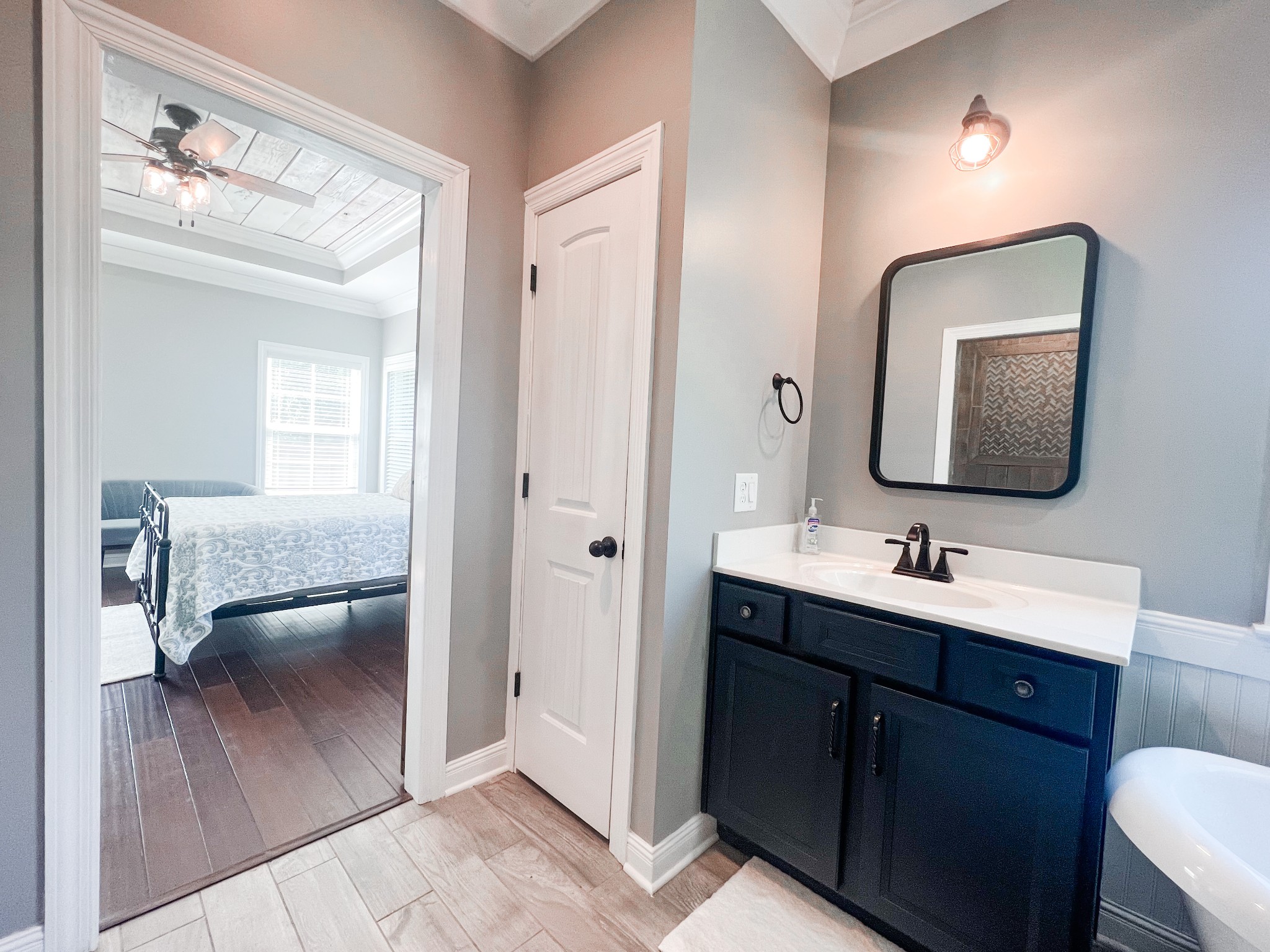 10848 Newtown Road Rockvale, TN 37153 - Photo 14 of 28 a bathroom with a toilet sink and mirror