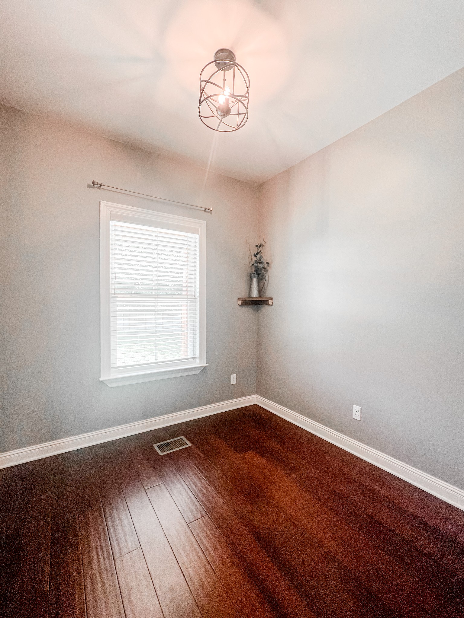 10848 Newtown Road Rockvale, TN 37153 - Photo 18 of 28 an empty room with wooden floor and windows