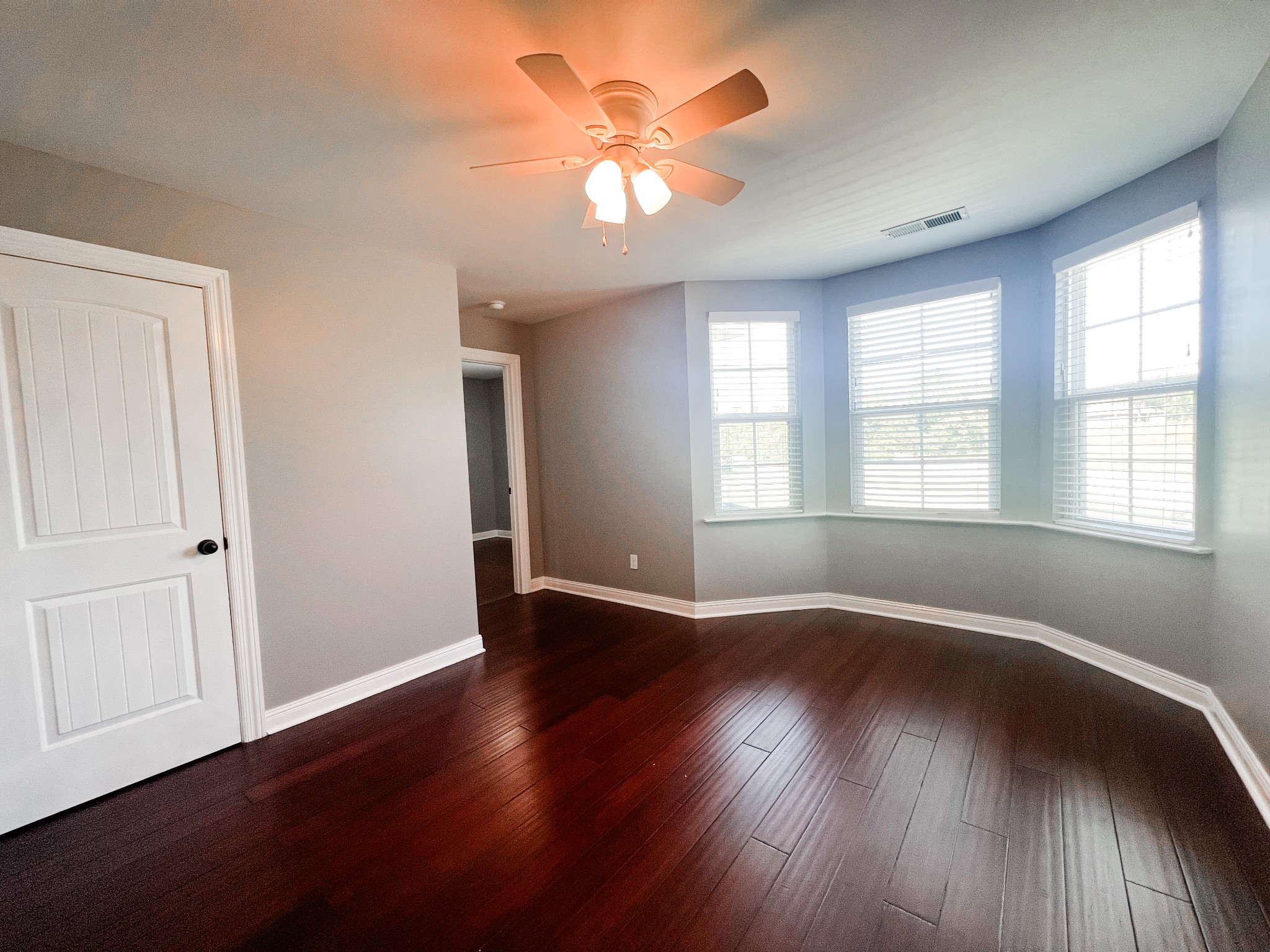 10848 Newtown Road Rockvale, TN 37153 - Photo 25 of 28 an empty room with wooden floor and windows
