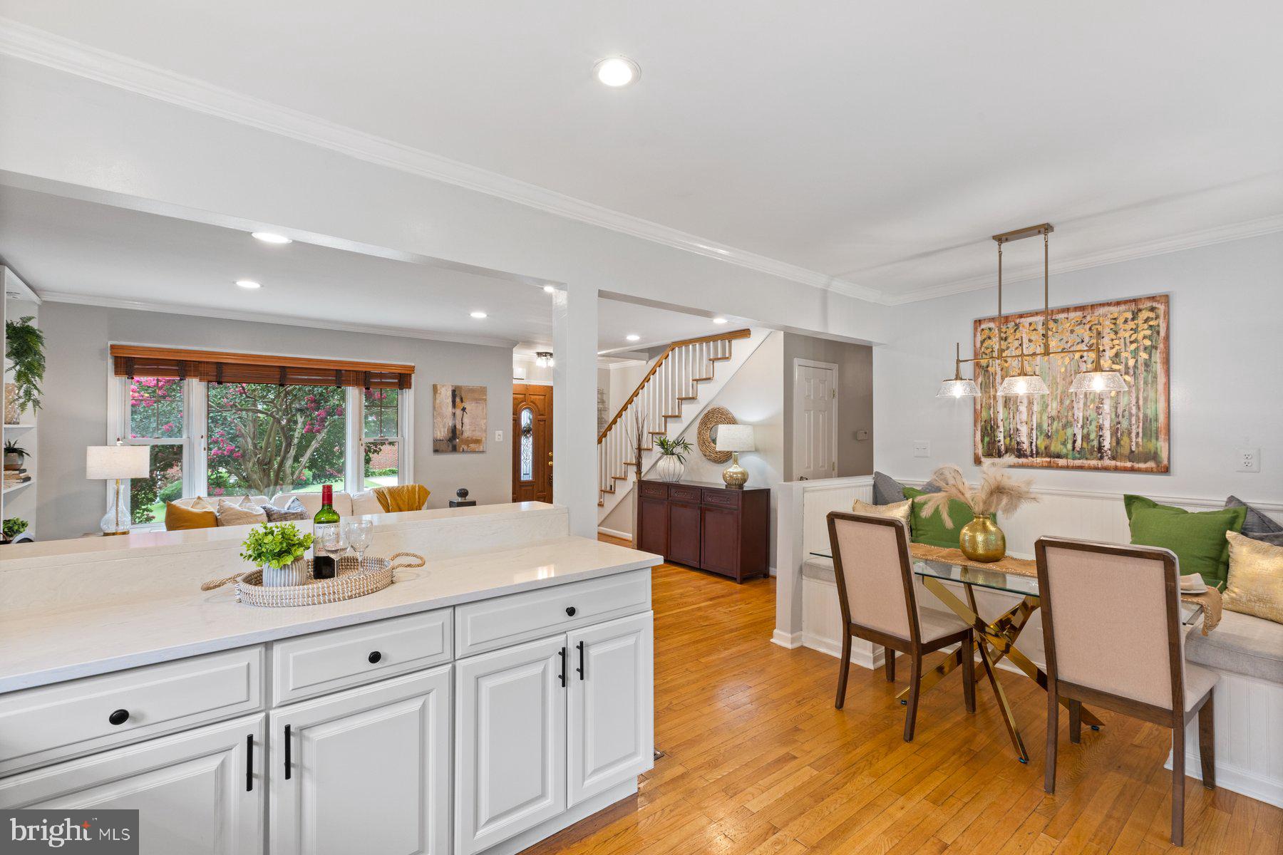 2605 Eccleston Street Silver Spring, MD 20902 - Photo 11 of 47 a view of dining table chairs wooden floor and kitchen view