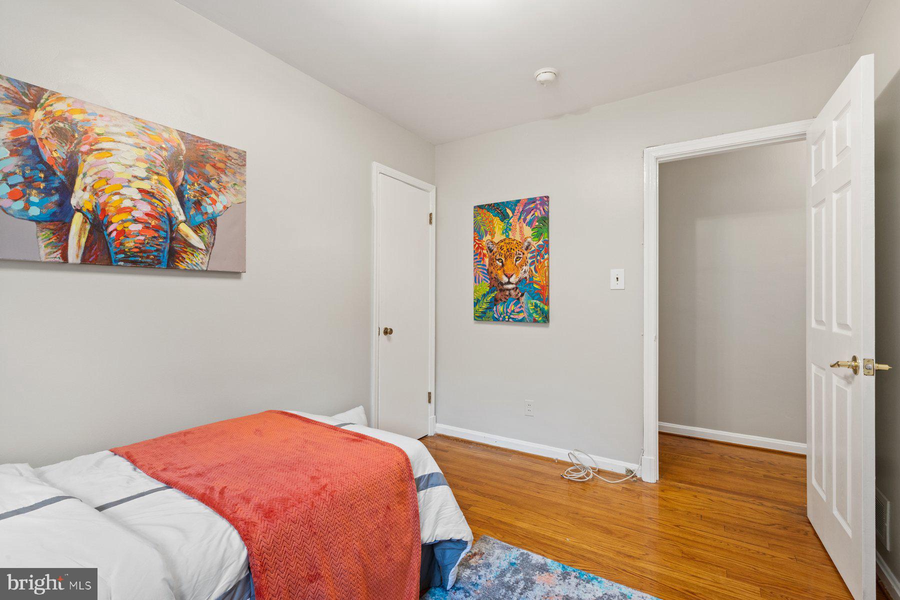 2605 Eccleston Street Silver Spring, MD 20902 - Photo 16 of 47 a bedroom with a bed and painting on the wall