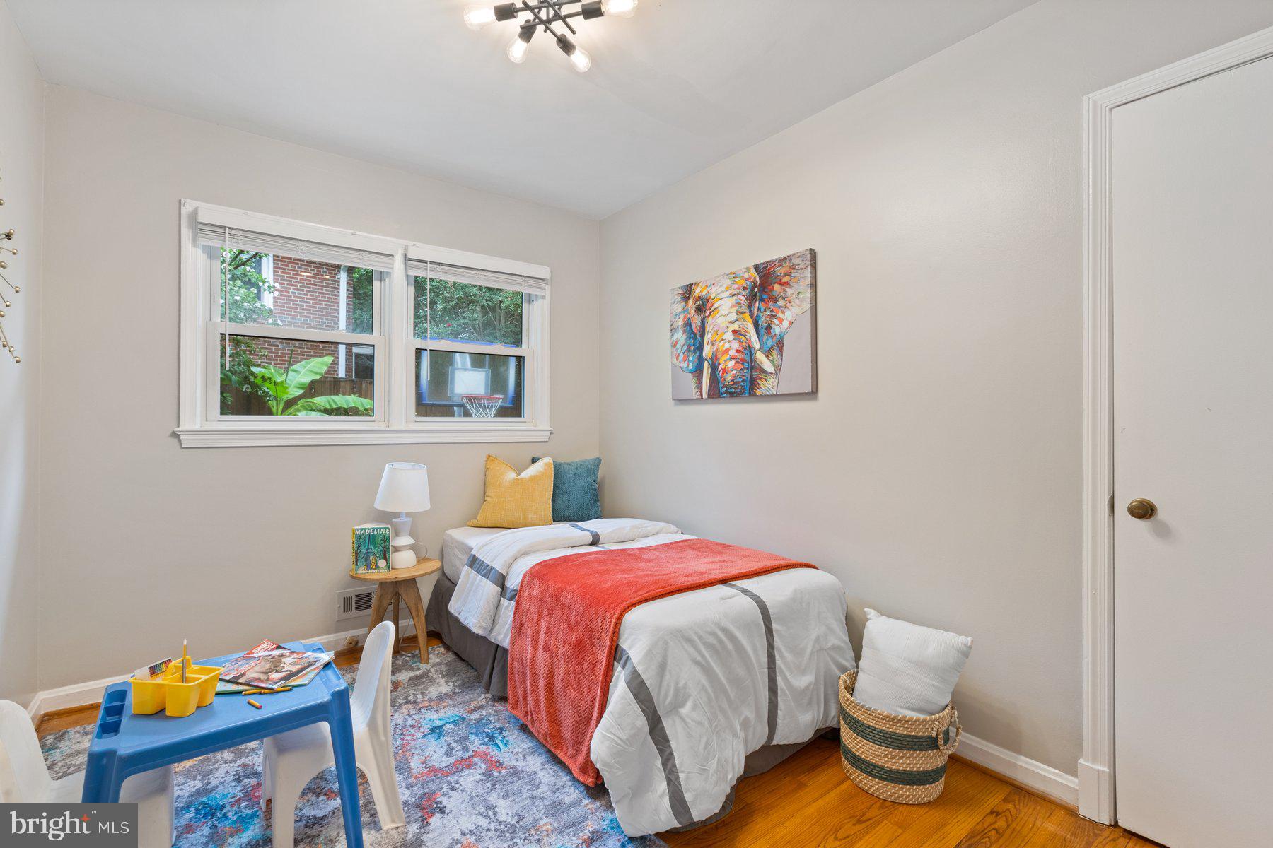 2605 Eccleston Street Silver Spring, MD 20902 - Photo 17 of 47 a bedroom with a bed and a window