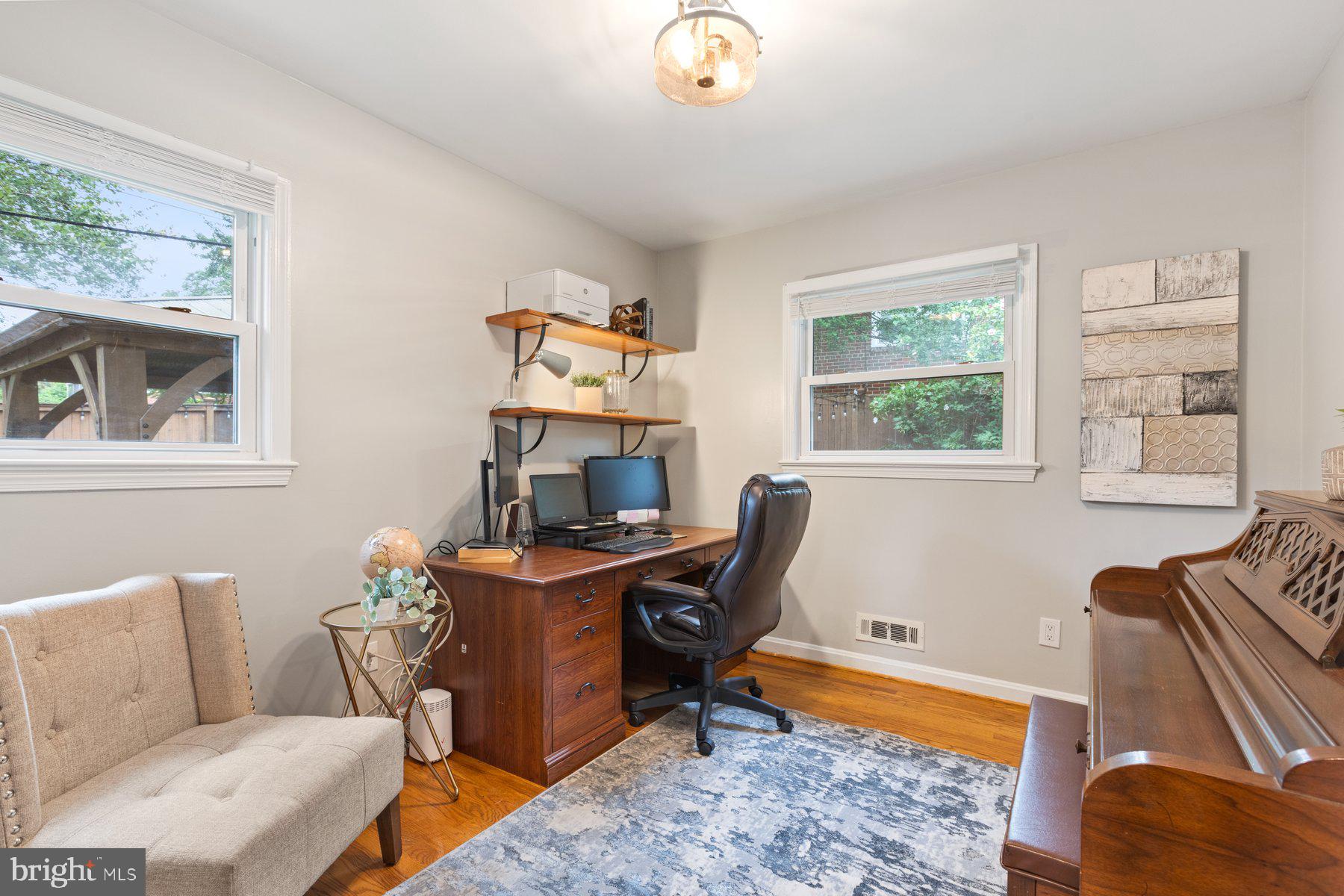 2605 Eccleston Street Silver Spring, MD 20902 - Photo 18 of 47 a workspace with furniture and a window