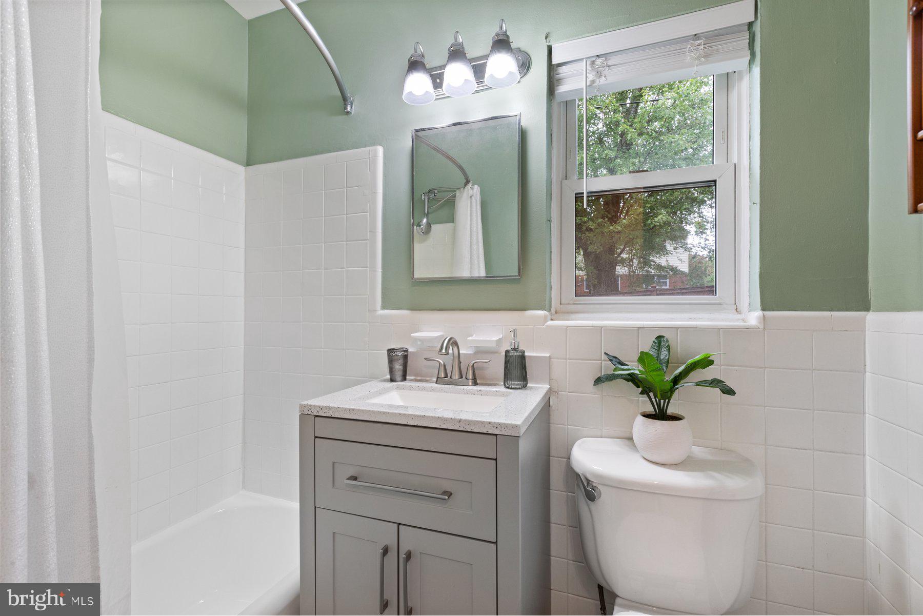 2605 Eccleston Street Silver Spring, MD 20902 - Photo 20 of 47 a bathroom with a sink a toilet and a mirror