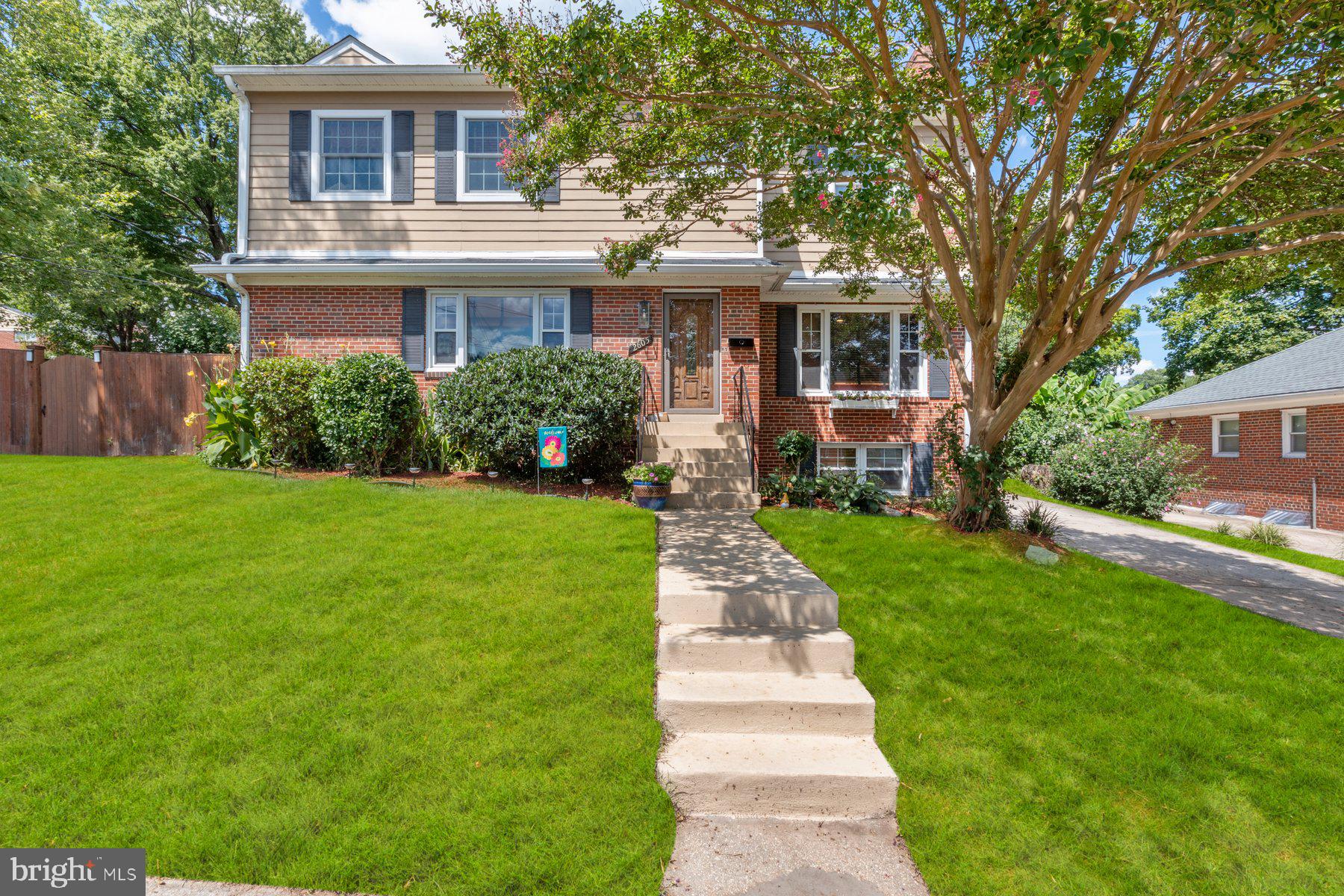 2605 Eccleston Street Silver Spring, MD 20902 - Photo 2 of 47 a front view of a house with a yard and porch