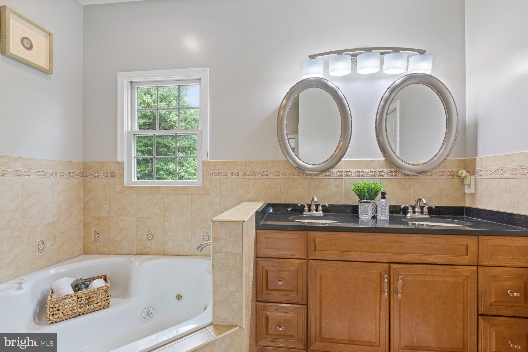 2605 Eccleston Street Silver Spring, MD 20902 - Photo 25 of 47 a bathroom with a sink and a mirror
