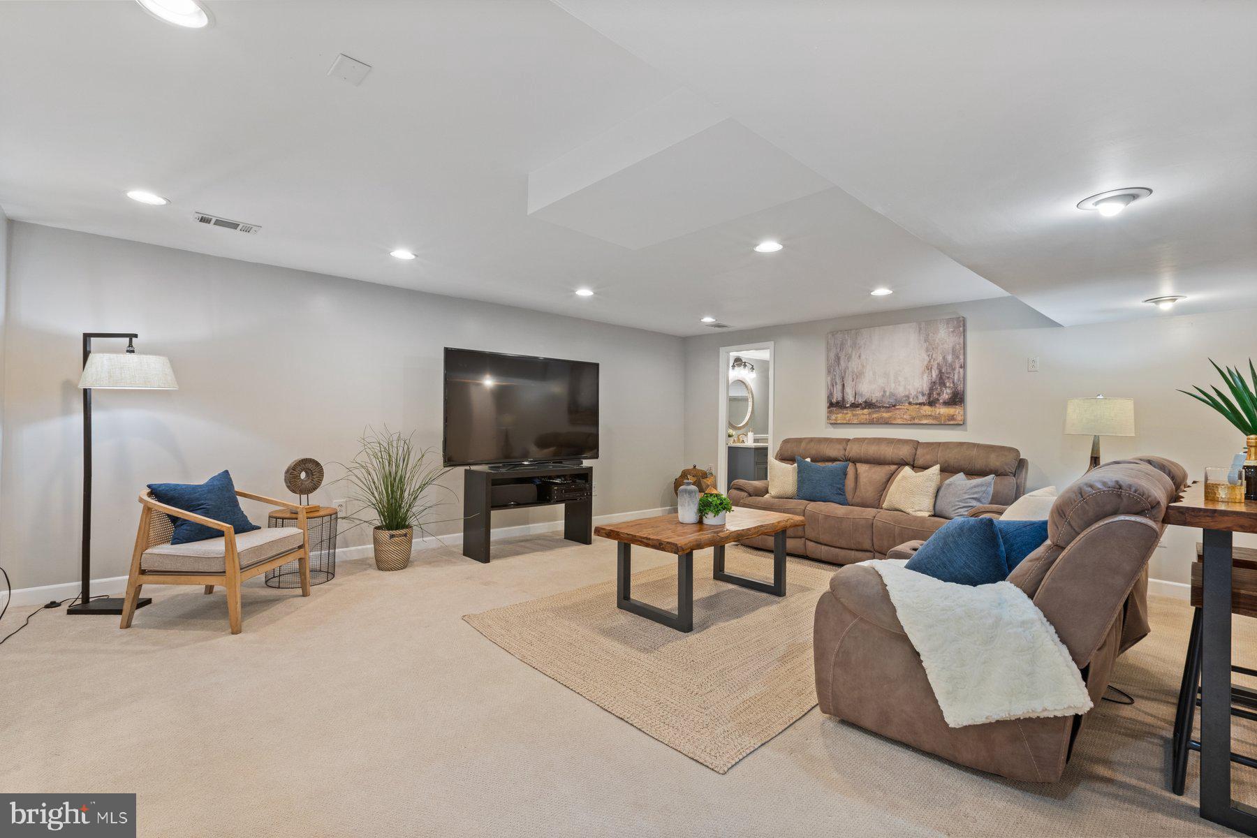 2605 Eccleston Street Silver Spring, MD 20902 - Photo 33 of 47 a living room with furniture and a flat screen tv