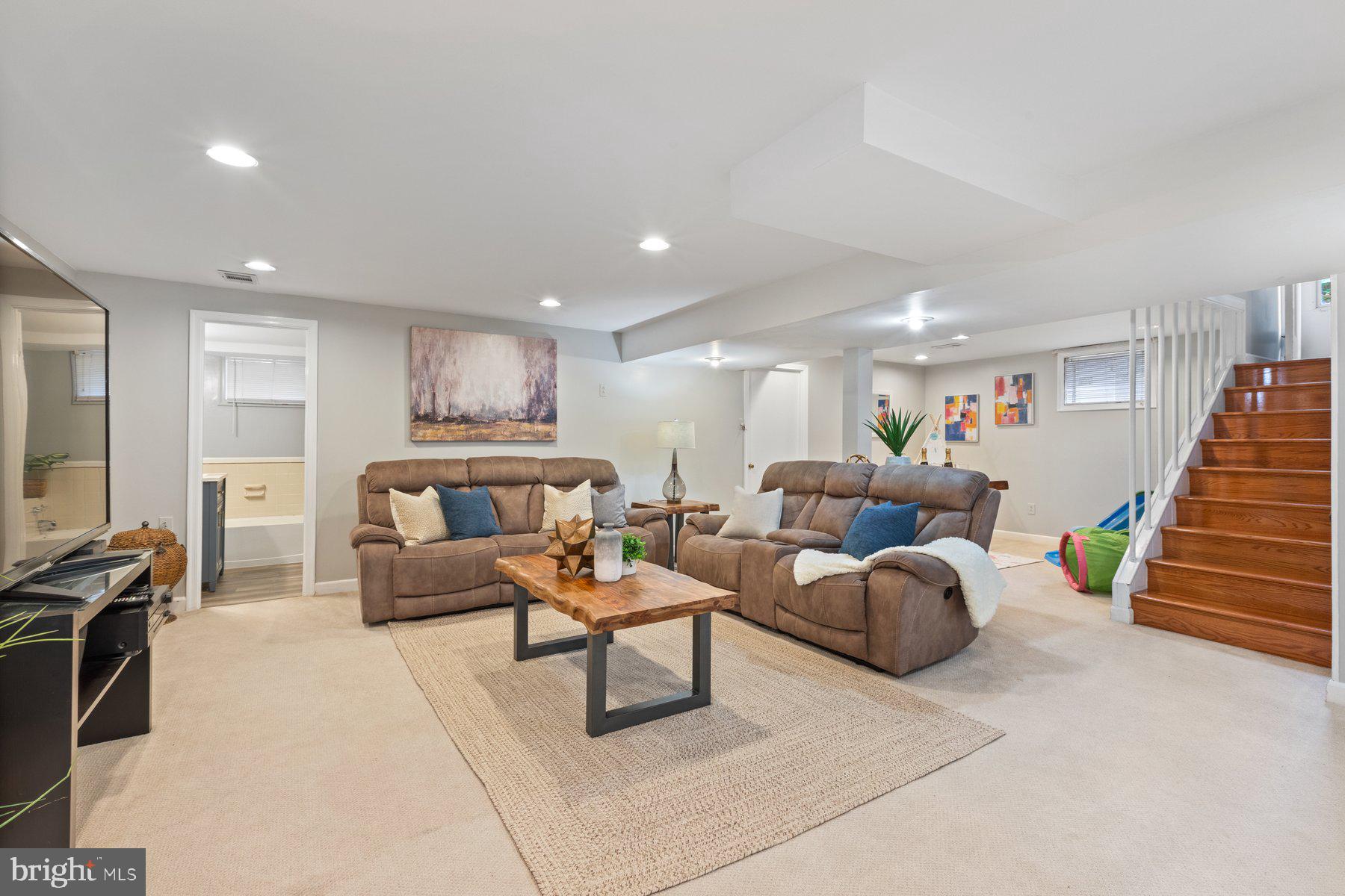 2605 Eccleston Street Silver Spring, MD 20902 - Photo 35 of 47 a living room with furniture and a flat screen tv