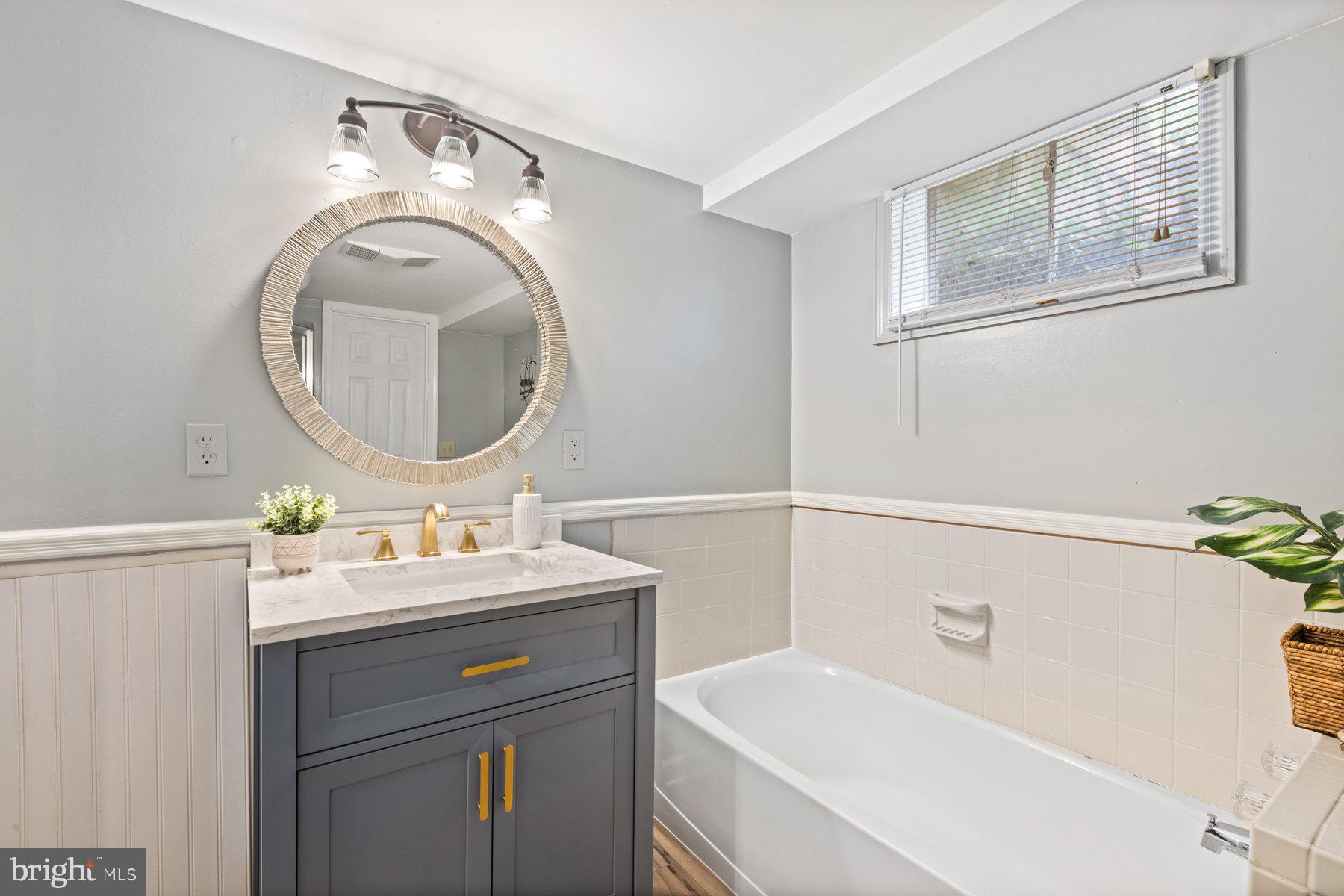 2605 Eccleston Street Silver Spring, MD 20902 - Photo 39 of 47 a bathroom with a sink and a mirror