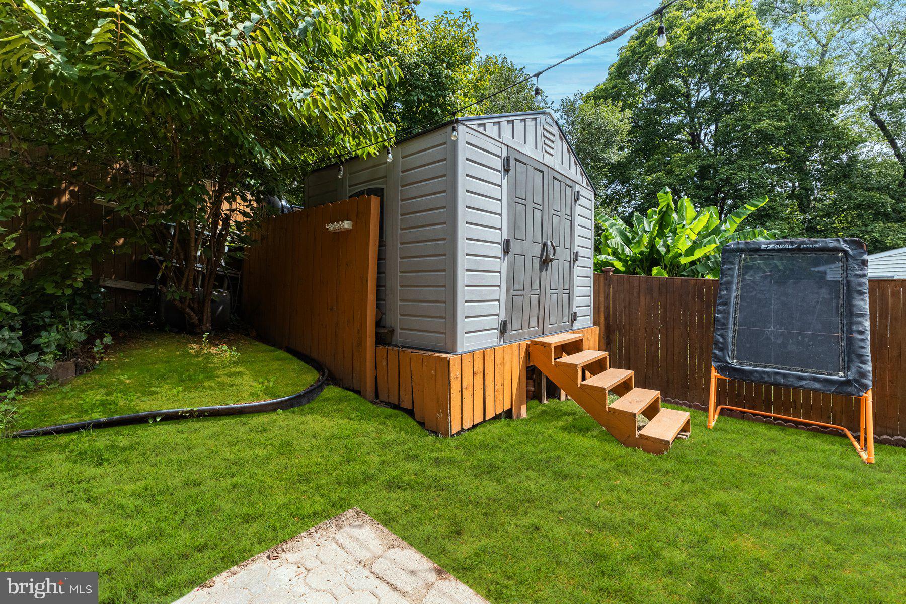 2605 Eccleston Street Silver Spring, MD 20902 - Photo 45 of 47 a view of a backyard with wooden fence and a bench
