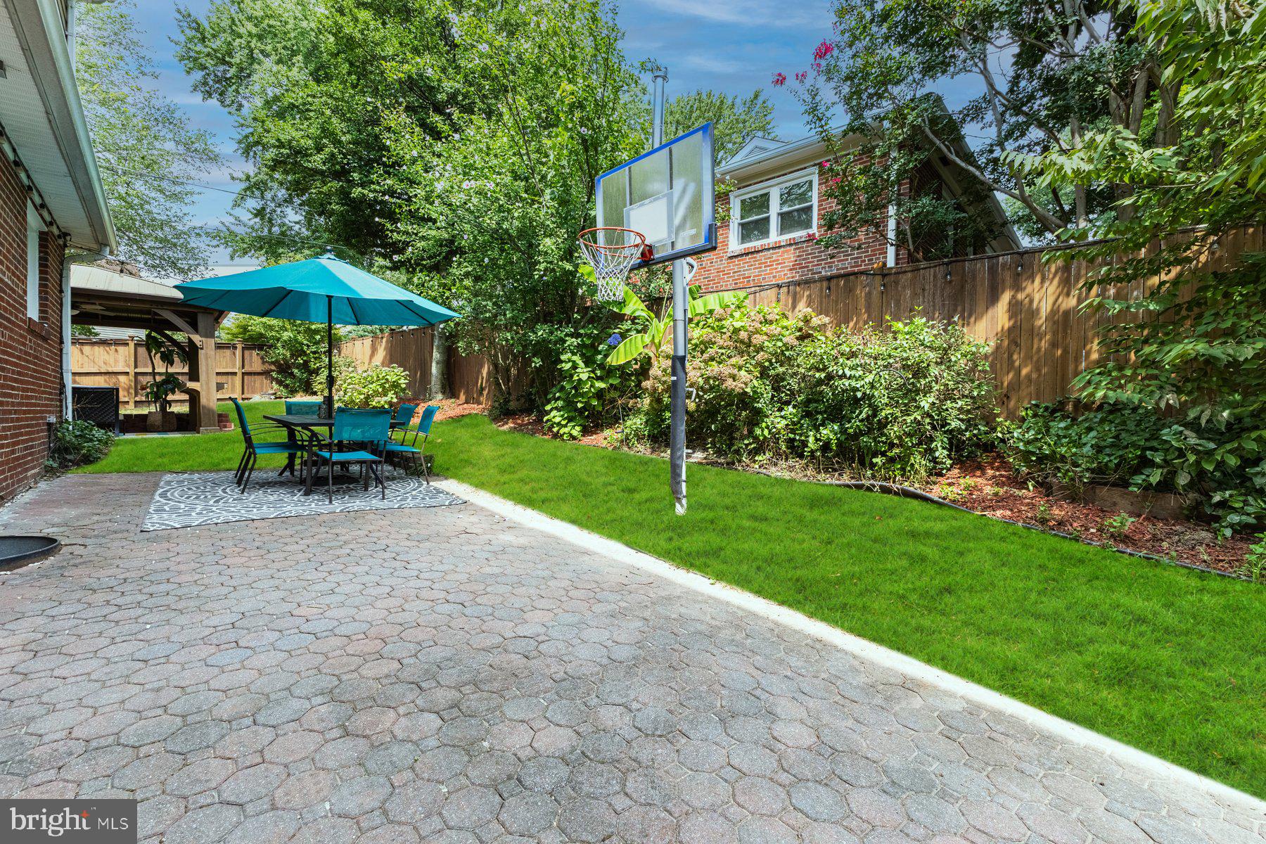 2605 Eccleston Street Silver Spring, MD 20902 - Photo 46 of 47 a view of a house with a yard and sitting area