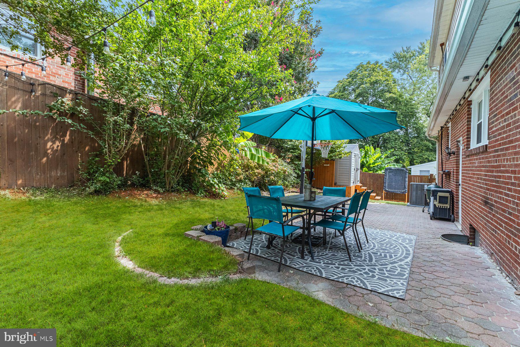 2605 Eccleston Street Silver Spring, MD 20902 - Photo 47 of 47 a view of a house with backyard sitting area and garden