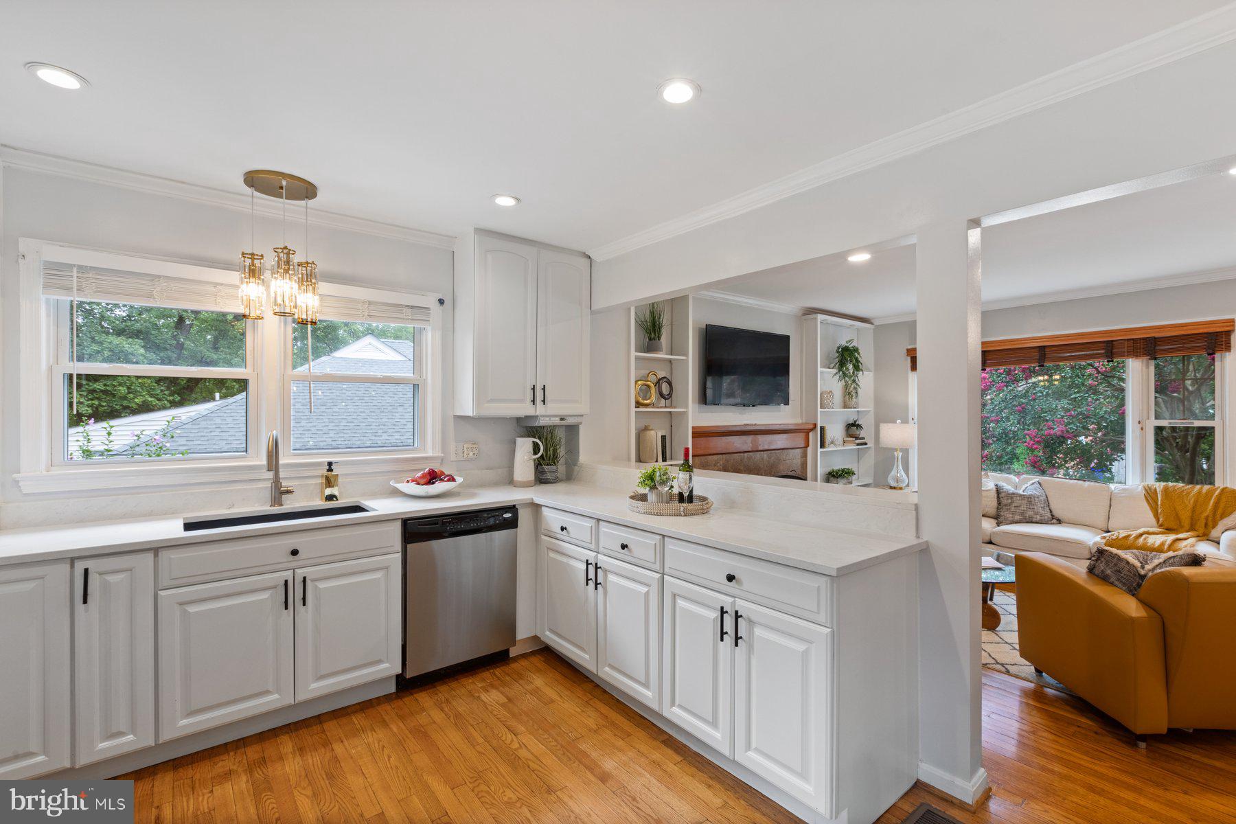 2605 Eccleston Street Silver Spring, MD 20902 - Photo 9 of 47 a kitchen with a sink window and cabinets