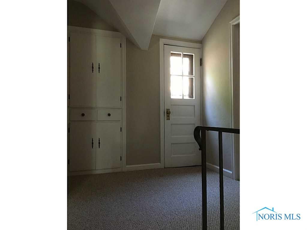 3811 Elmhurst Road Toledo, OH 43613 - Photo 11 of 19 Other. Landing upstairs with built-in linen closet and shelving. Door leads to airing deck.