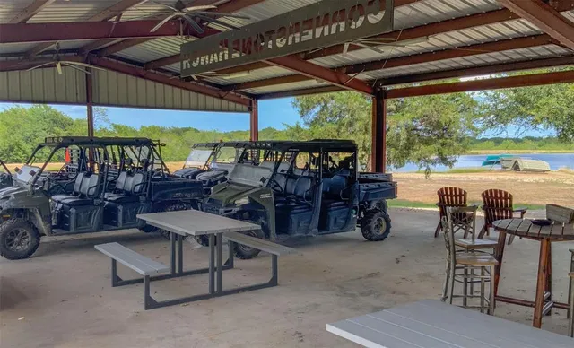 a view of a house with yard and tree s