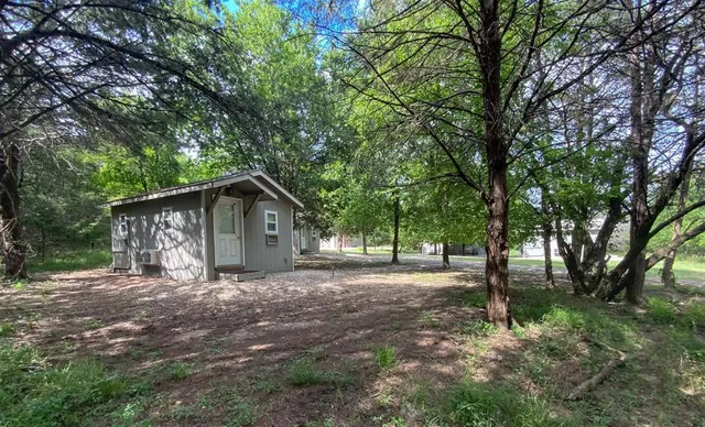 a bathroom with a granite countertop toilet sink and shower