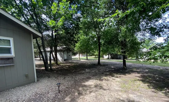 a view of a lake with houses in the back