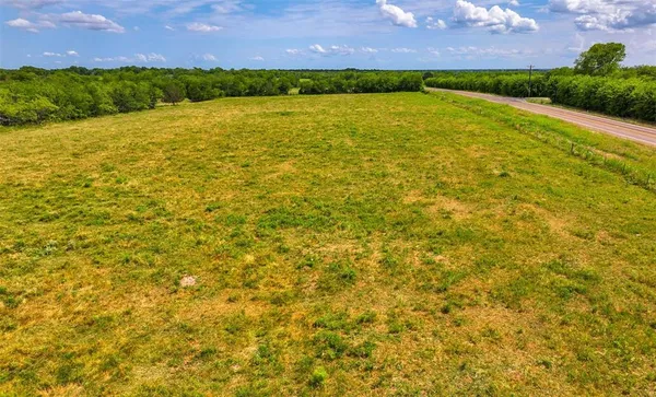 a view of a lake with a house in the background