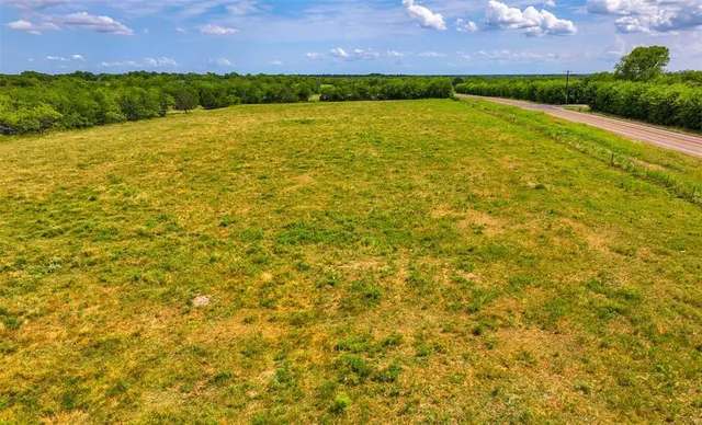 a view of a lake with a house in the background