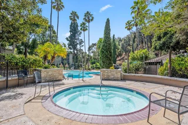 a view of a house with a tree in front