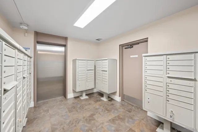 a view of washer and dryer with kitchen in the background