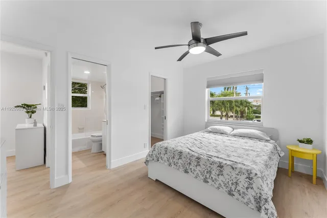 a bedroom with a bed and a table