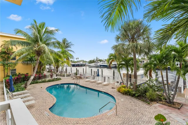 a view of a swimming pool with a house