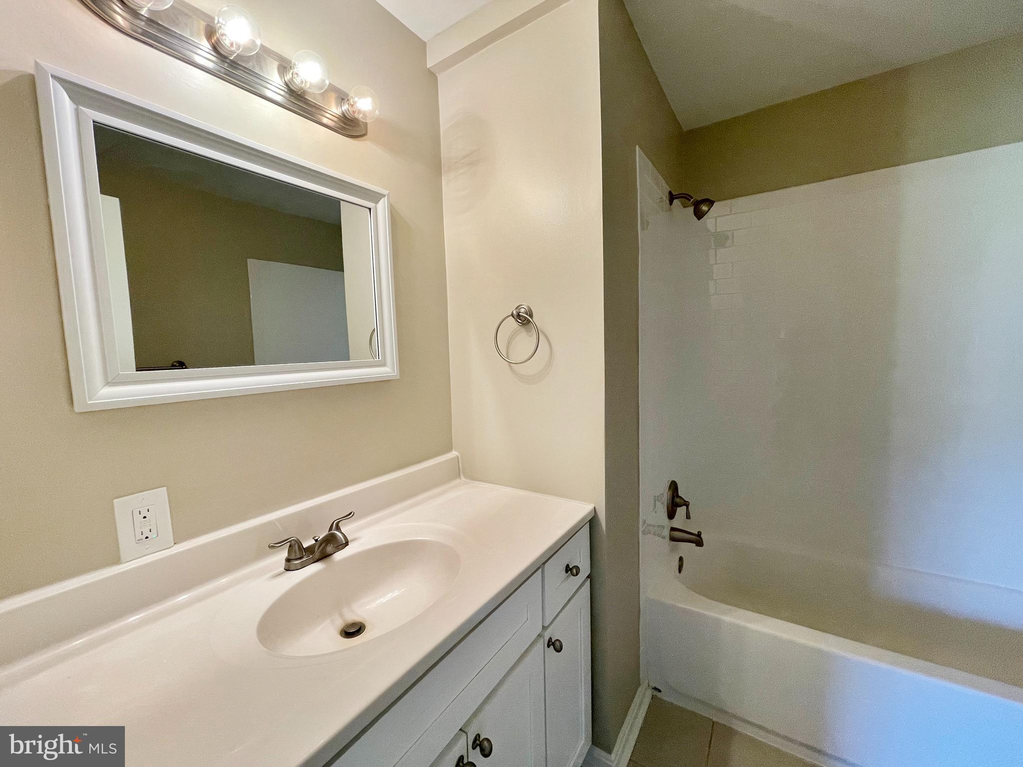 2151 Carrs Mill Road Fallston, MD 21047 - Photo 28 of 35 a bathroom with a tub sink vanity granite and mirror