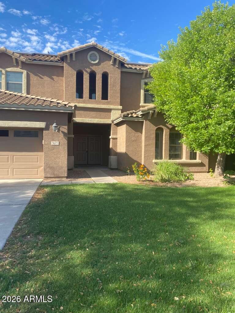 9677 Barley Road Florence, AZ 85132 - Photo 2 of 22 a front view of a house with a yard