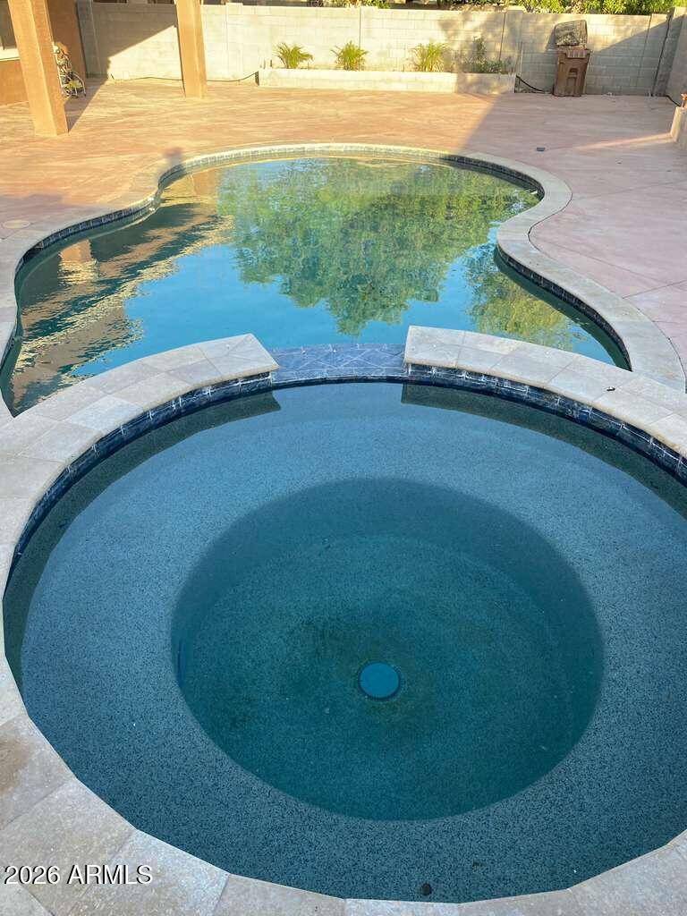 9677 Barley Road Florence, AZ 85132 - Photo 22 of 22 a view of a swimming pool with lawn chairs