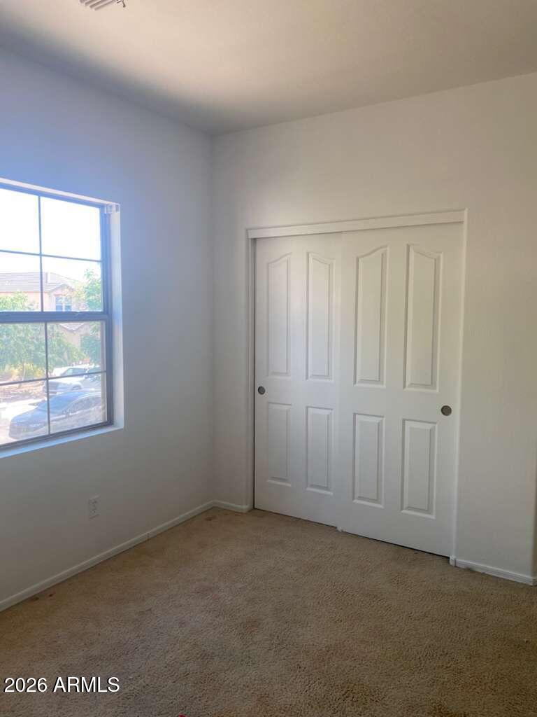9677 Barley Road Florence, AZ 85132 - Photo 5 of 22 a view of an empty room with a window