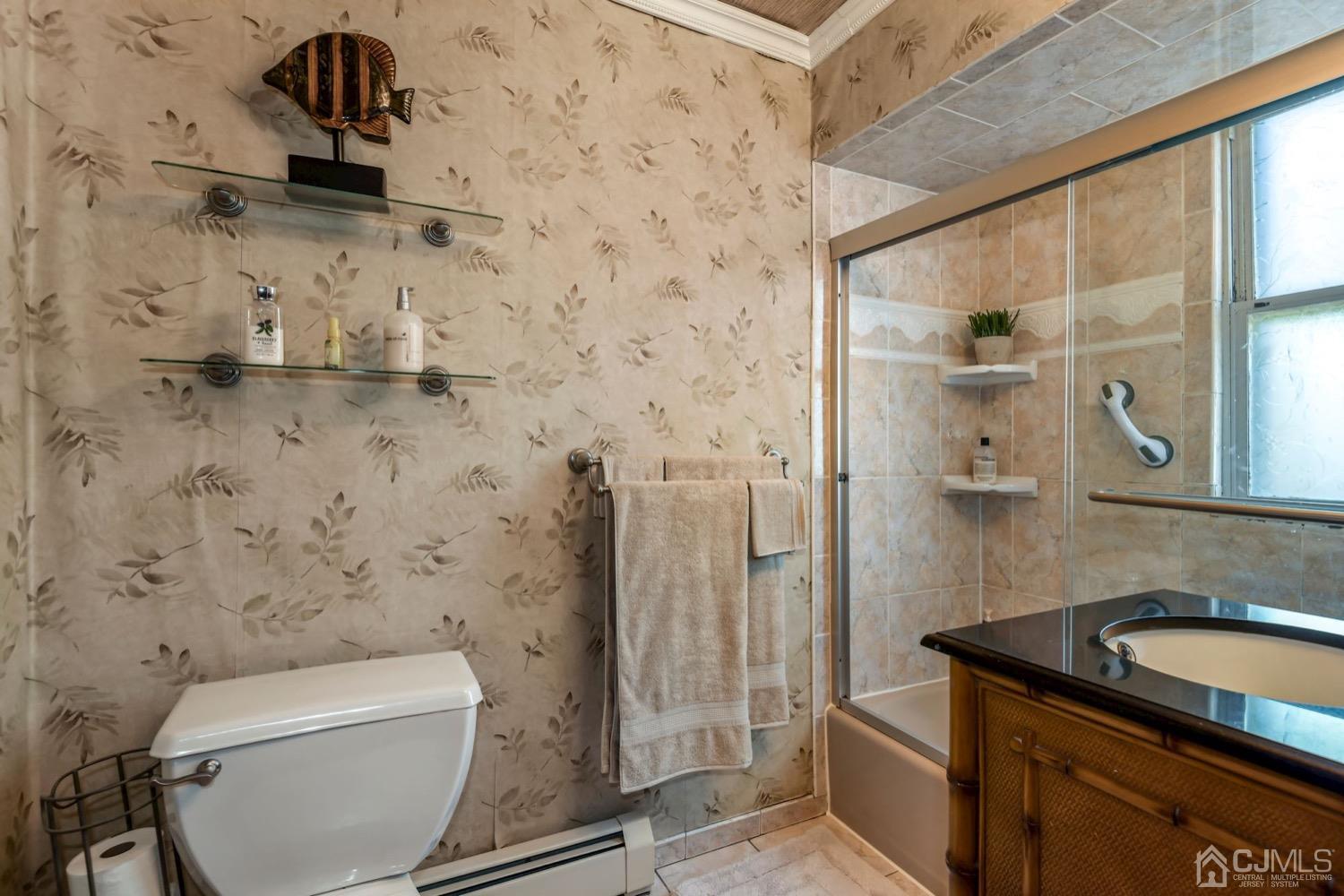 390 Cliff Road Sewaren, NJ 07077 - Photo 24 of 32 a bathroom with a sink a toilet and shower