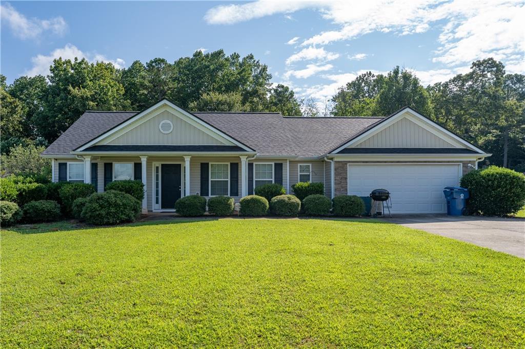173 Celestial Run Winder, GA 30680 - Photo 1 of 1 a front view of a house with a yard and garage