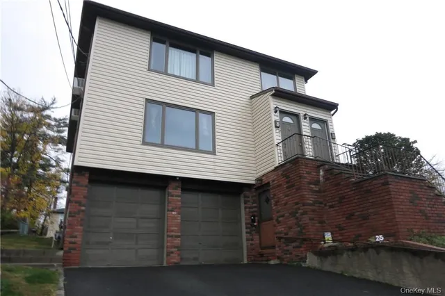a front view of a house with a garage