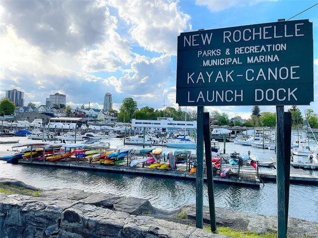 a city view with boat and cars