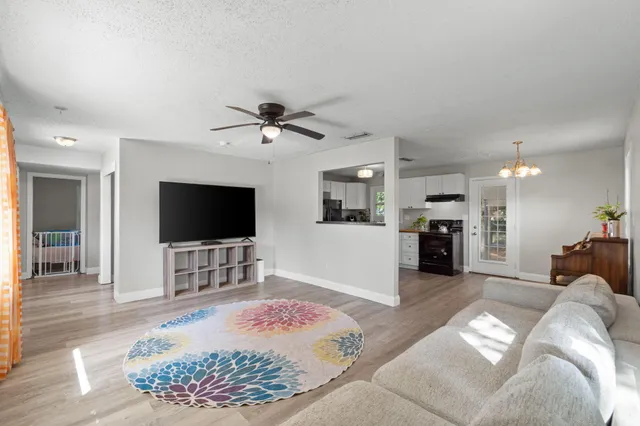 a living room with furniture and a window
