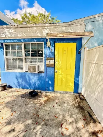 a view of front door and wooden floor