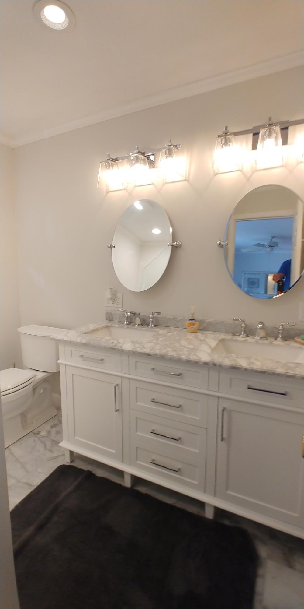 17042 Traverse Circle Jupiter, FL 33477 - Photo 23 of 30 a bathroom with a sink double vanity and a mirror