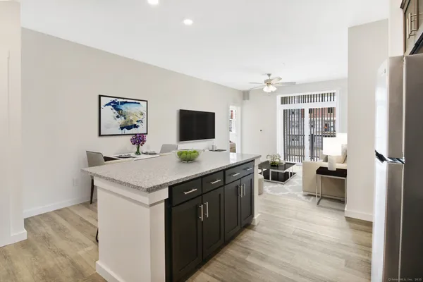 a kitchen with a stove and a refrigerator