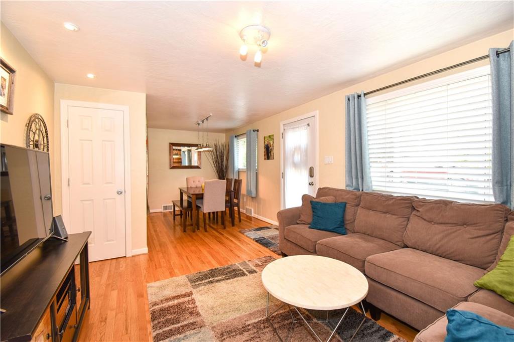 378 Streets Run Road Pittsburgh, PA 15236 - Photo 4 of 19 Living room / dining room combination with huge windows!