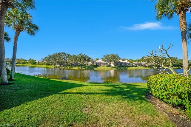 a view of a lake with a house in the background