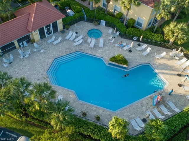 an aerial view of a house with garden space and street view
